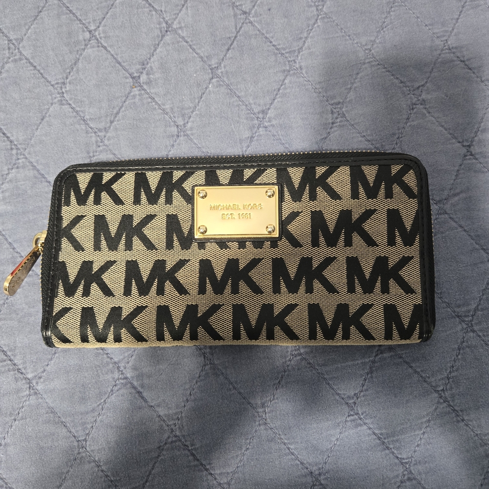 Michael Kors Black MK Monogram Zip Wallet with Beige Background
